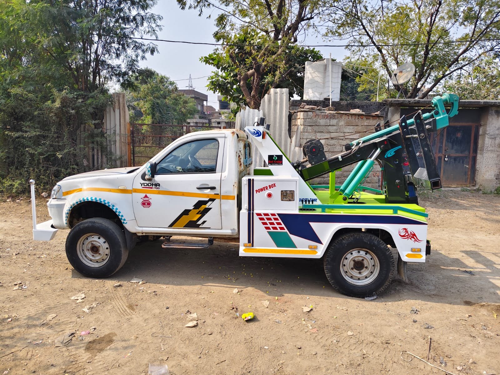 Rear view of Urvi Crane recovery van showing crane winch and warning lights